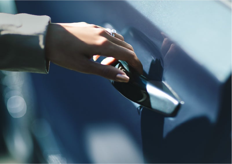 A hand gracefully grips the Light Touch Handle of a 2023 Lincoln Aviator® SUV to demonstrate its ease of use | Bergstrom Lincoln of Neenah in Neenah WI