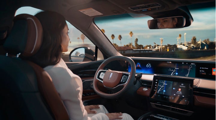 A person is shown driving hands-free on the highway with available Lincoln BlueCruise technology. | Bergstrom Lincoln of Neenah in Neenah WI