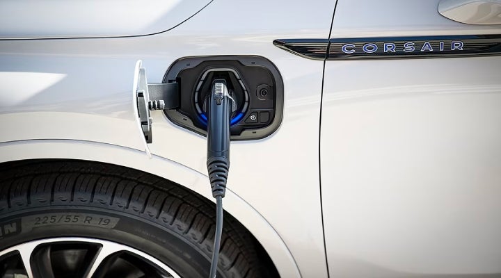 An electric charger is shown plugged into the charging port of a Lincoln Corsair® Grand Touring
model. | Bergstrom Lincoln of Neenah in Neenah WI