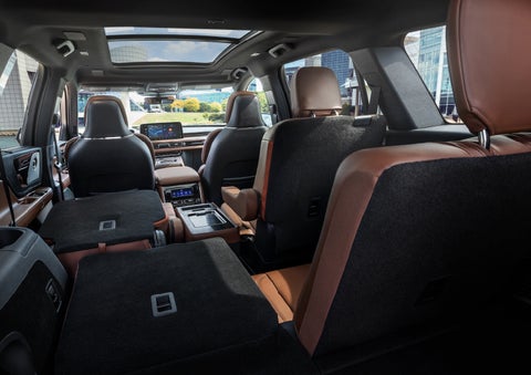 The interior of the 2025 Lincoln Aviator® SUV is shown with two seats folded down for added space. | Bergstrom Lincoln of Neenah in Neenah WI