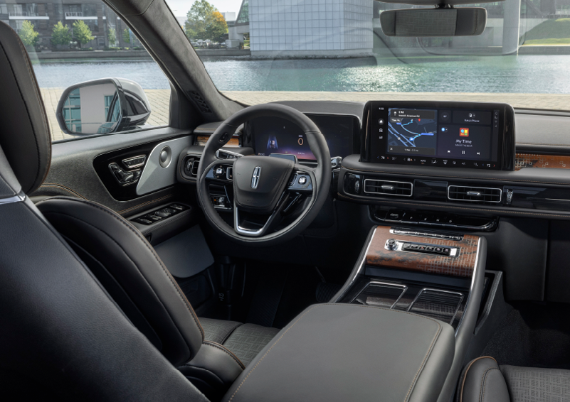 The interior of the 2025 Lincoln Aviator® SUV is shown parked with a view of a harbor through the windshield. | Bergstrom Lincoln of Neenah in Neenah WI