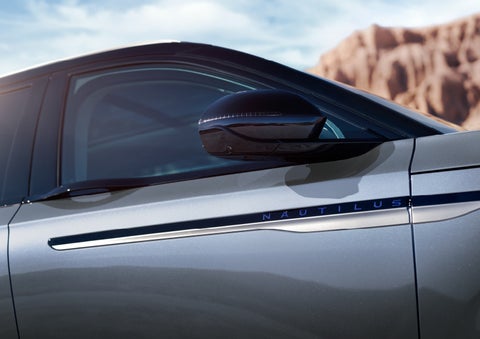 Blue lettering on the side of the vehicle that reads nautilus indicates the available hybrid powertrain. | Bergstrom Lincoln of Neenah in Neenah WI