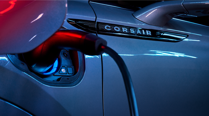 A charger plugged into the charging port of a 2025 Lincoln Corsair® Plug-in Hybrid model. | Bergstrom Lincoln of Neenah in Neenah WI
