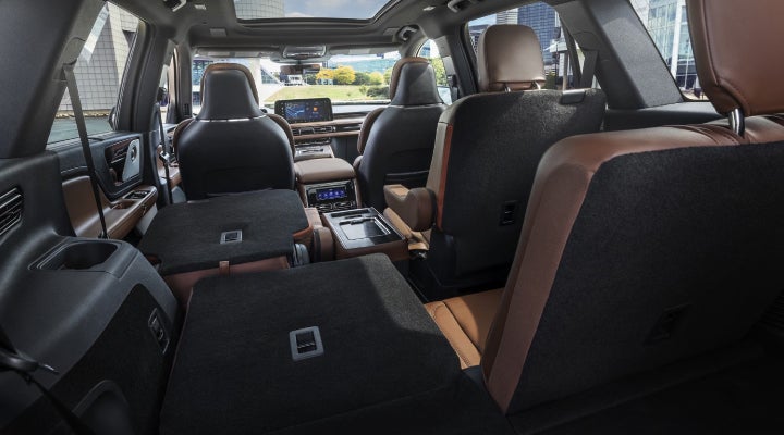 One side of the PowerFold® third-row seat and a second-row seat are folded forward in the 2026 Lincoln Aviator® SUV. | Bergstrom Lincoln of Neenah in Neenah WI
