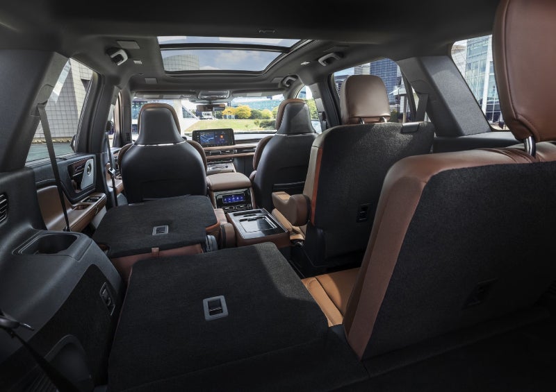 One side of the PowerFold® third-row seat and a second-row seat are folded forward in the 2026 Lincoln Aviator® SUV. | Bergstrom Lincoln of Neenah in Neenah WI