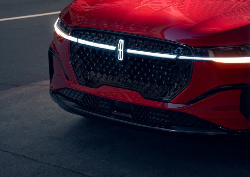 The available front LED light bar and center Lincoln Star logo glow at dusk. | Bergstrom Lincoln of Neenah in Neenah WI