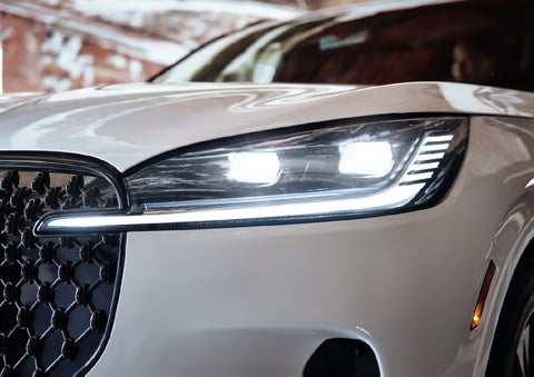 A close-up of a headlamp on the 2027 Lincoln Aviator® SUV is shown. | Bergstrom Lincoln of Neenah in Neenah WI