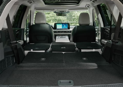 A rear to front view of the interior of a 2027 Lincoln Aviator® Black Label™ SUV shows the third and second rows folded flat | Bergstrom Lincoln of Neenah in Neenah WI