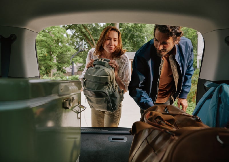 A couple loads luggage into the rear of a 2027 Lincoln Aviator® Black Label™ SUV..e 202 | Bergstrom Lincoln of Neenah in Neenah WI